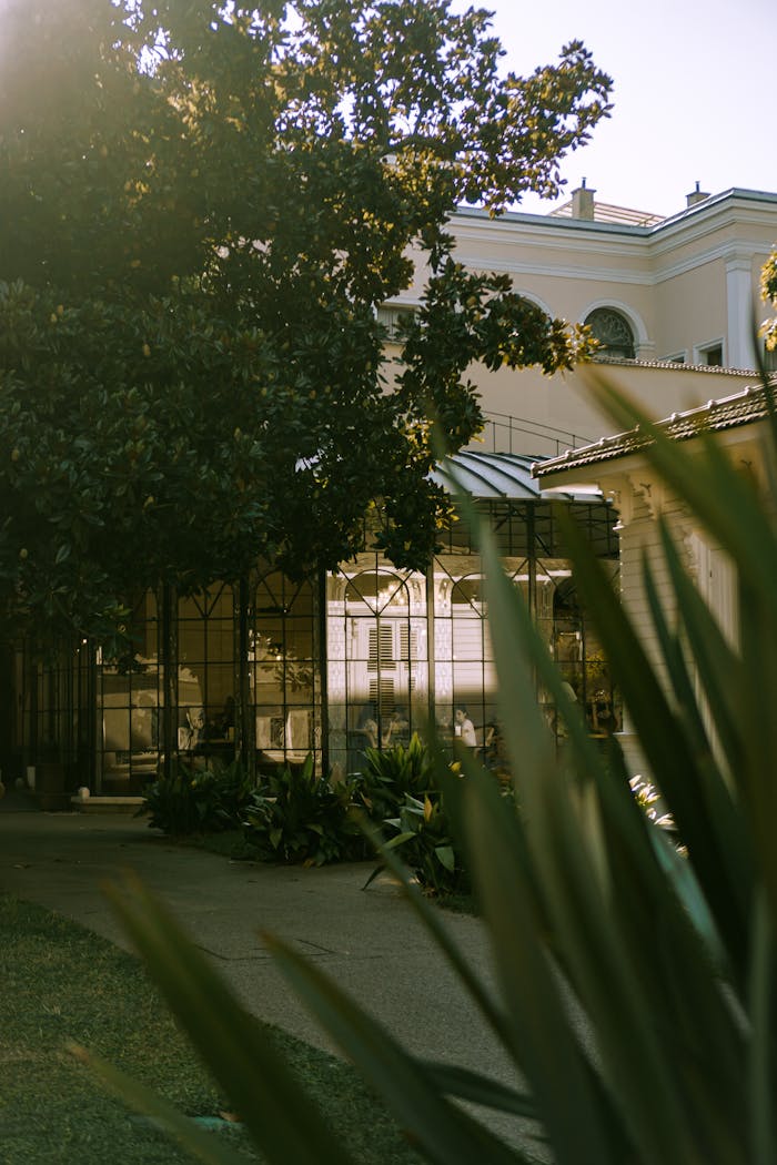 Beautiful urban setting featuring historic architecture and a lush garden.